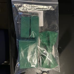 Green bow tie and suspenders.